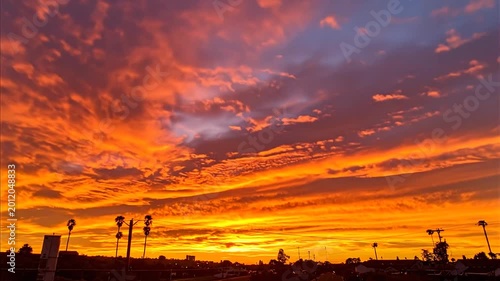 Vibrant orange and purple sunset landscape.