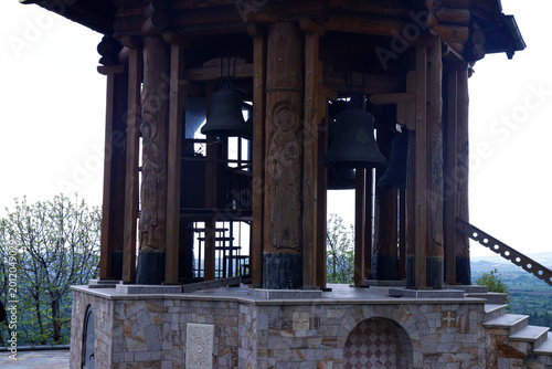 Принти на полотні Carved Wooden Bell Tower and Bronze Bells of Orthodox Monastery