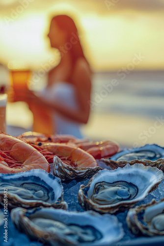 Fresh seafood platter with oysters and shrimp, perfect for a dinner party or special occasion vertical frame