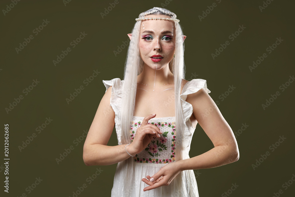 Naklejka premium Beautiful elf girl on dark olive background