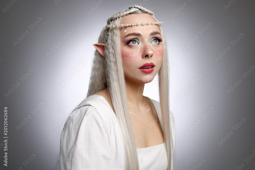 Naklejka premium Beautiful elf girl on grey gradient background