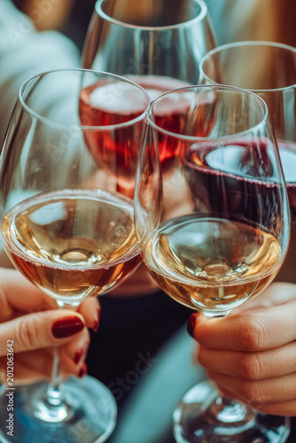Group of friends enjoying wine tasting, one phrase with advice on where to use this picture vertical frame