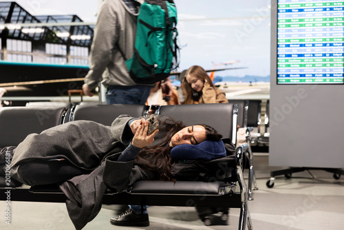 Εκτύπωση καμβά Resting, phone and bored girl in airport telling family about arriving late home for holidays