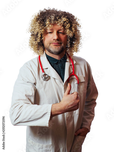 Hippie looking doctor with huge curly style haircut in white uniform and red stethoscope, thumbs up gesture. White background. Stylish male professional expressing positive energy.