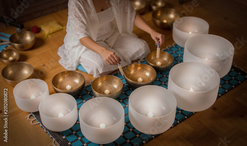 Bild auf Leinwand Stress Relief Sound Bath Meditation with frosted crystal and Tibetan singing bow