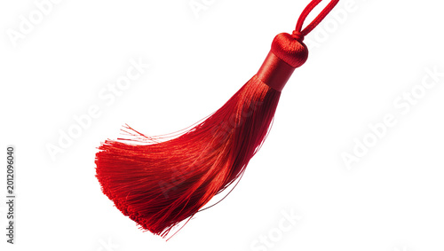 Fotografía Isolated bright red silk tassel, elegant decorative accessory for graduation and