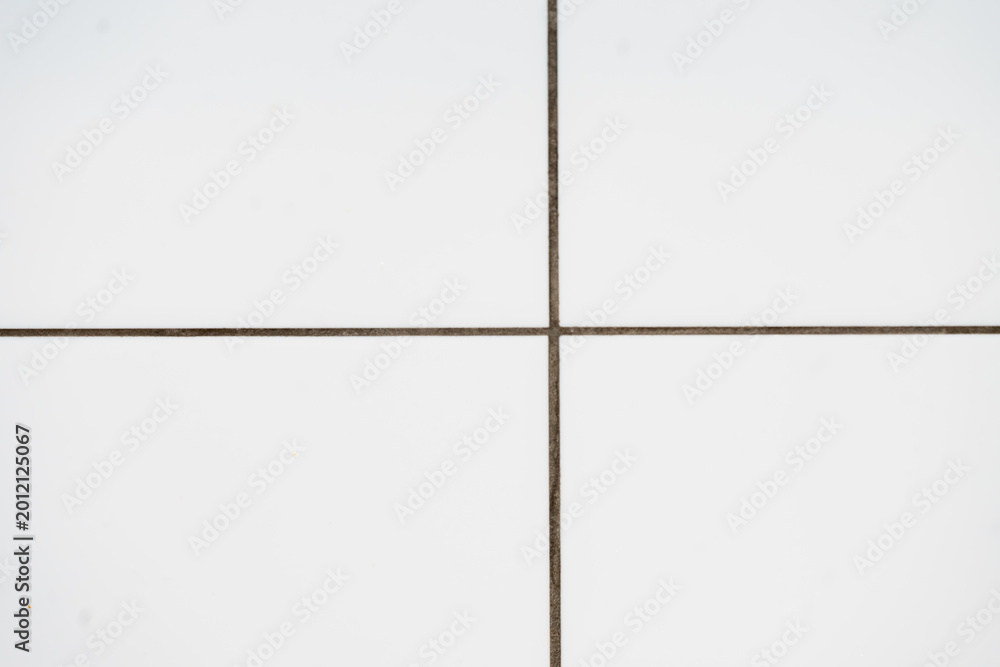 Fototapeta premium white tiled wall pattern off centre background