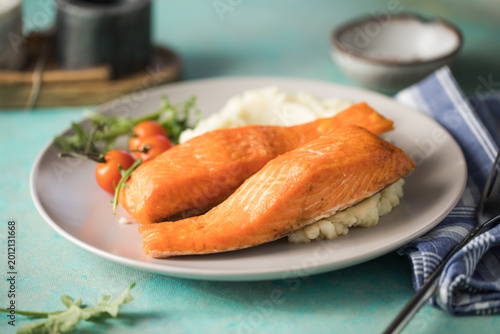 Grilled salmon fish fillet and green salad