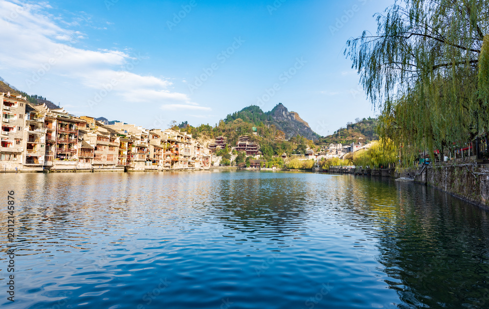 Fototapeta premium Panoramic Winter Sunset Scenery of Zhenyuan Ancient Town in Qiandongnan, Guizhou, China