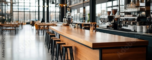 Spacious modern cafe interior, long wooden bar with stools and espresso machines. Clean, inviting design, ready for coffee and hospitality. cafe, bar