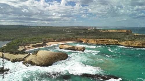 Sherbrook River Beach, Great Ocean Road, Port Campbell, Victoria: 4K aerial drone footage of river mouth, sandy beach, coastline and coastal cliffs near Thunder Cave and Mutton Bird Island