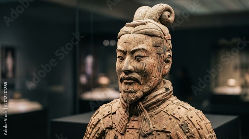 Terracotta warrior sculpture details weathered clay ancient chinese army artifact.