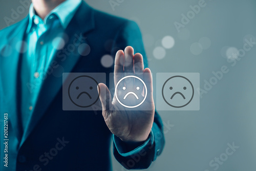 Negative customer feedback and bad review concept with sad face icon on virtual interface, poor user experience, client dissatisfaction, low rating, service complaint and unhappy customer evaluation