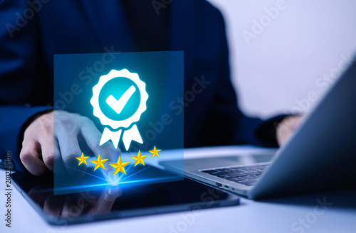 Tableau sur toile Customer satisfaction and quality assurance concept with five star rating and approval badge on digital tablet, business review feedback, trusted service evaluation and client experience technology