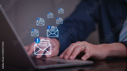 Email security cyber threat threat detection phishing spam inbox laptop businessman Businessman using laptop with email security for cyber threat