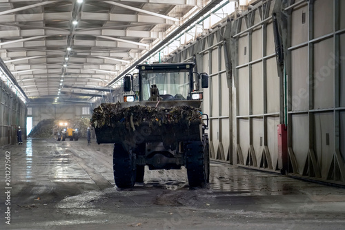 Foto Machine moves through a waste processing plant, processing mixed household waste and preparing materials for recycling