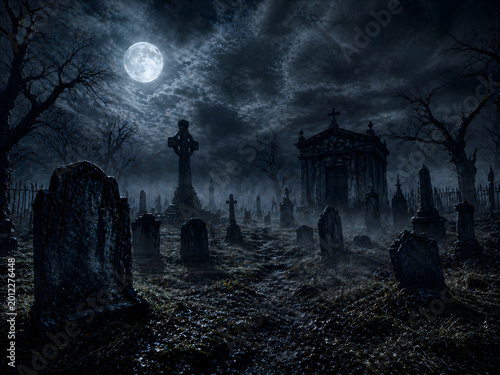 Spooky graveyard at night with a full moon and eerie mist creating a haunted atmosphere