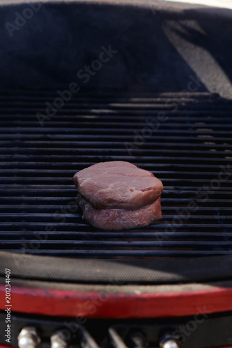 Photography Thick beef fillet mignon steak searing on a hot grill grate