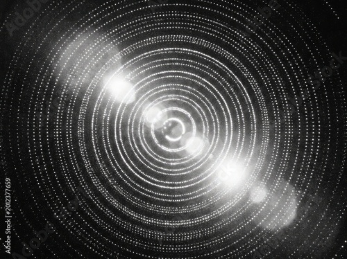 Abstract circular patterns with bright lens flares creating a futuristic, technological, and energetic visual effect