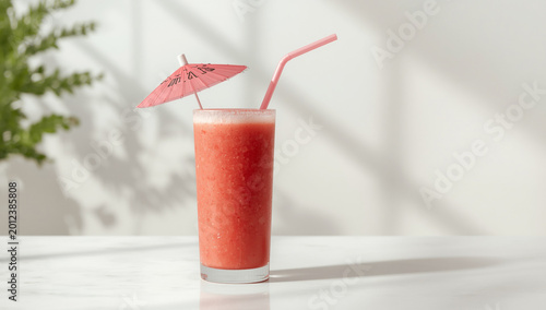 Refreshing Summer Watermelon Drink in Glass with Fresh Fruit Slices on Table