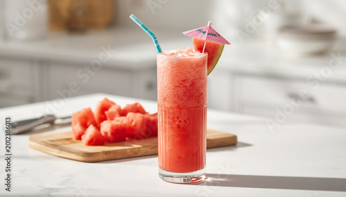 Refreshing Summer Watermelon Drink in Glass with Fresh Fruit Slices on Table