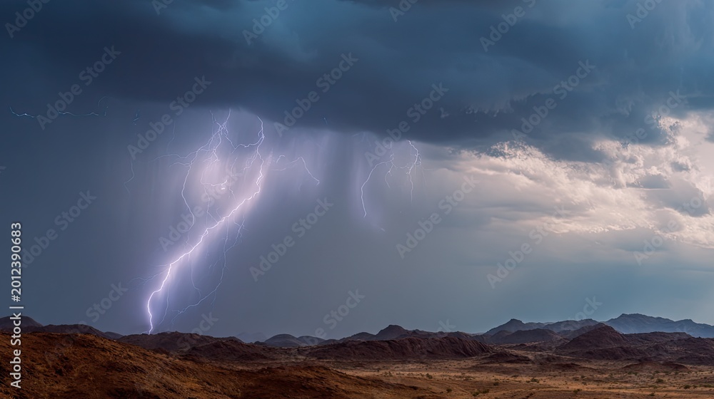 Fototapeta premium Lightning strike illuminating desert landscape during thunderstorm