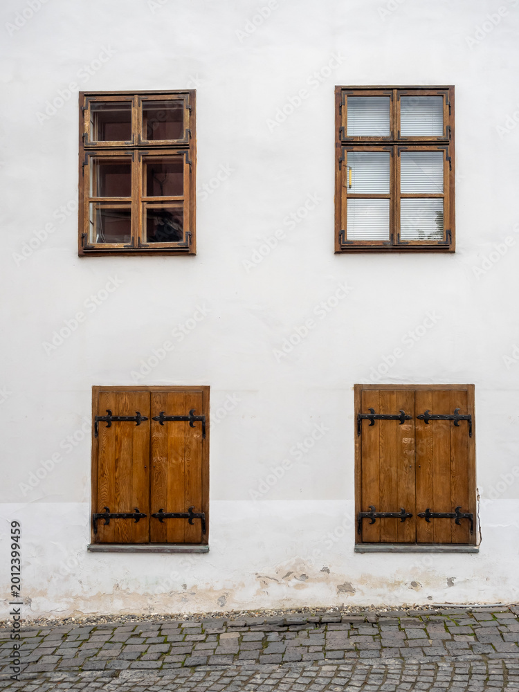 Fototapeta premium Traditional house facade with wooden windows in Sighisoara Romania