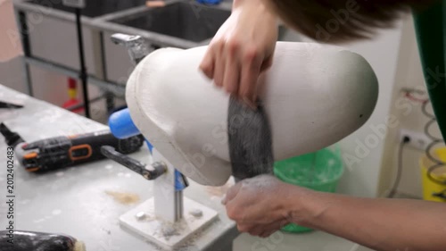 Orthopedic technician crafting prosthetic limb socket