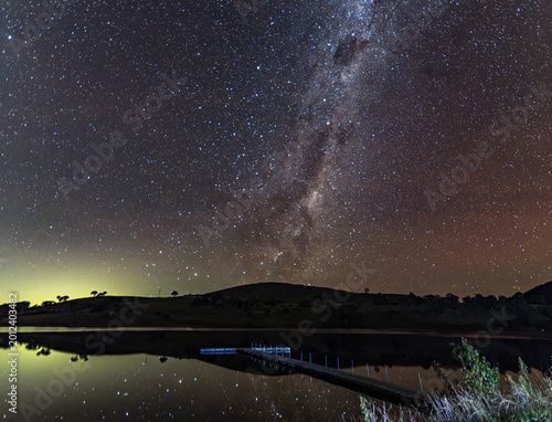 Quadro su tela Aurora Australis diffuse in the night sky with The Milky Way