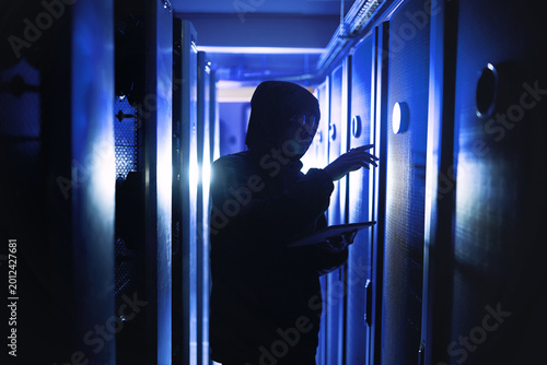 Εκτύπωση καμβά Criminal, person and hacking with tablet in server room for coding, cyberattack and data breach