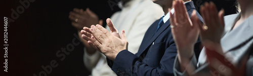 Fotografie Business professionals clapping during corporate event, showing recognition, support, teamwork, and success
