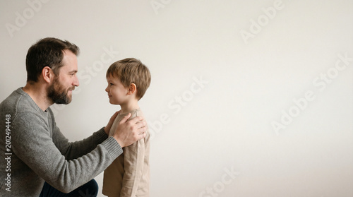 Caring Father Talking to Little Son for Global Day of Parents and International Day of Families, Supportive Dad Guiding Child, Family Connection and Emotional Support Concept