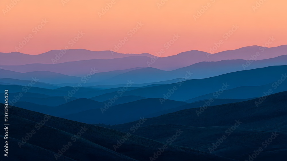 Fototapeta premium layered mountain range silhouette against a vibrant pink and blue sunset sky high-quality