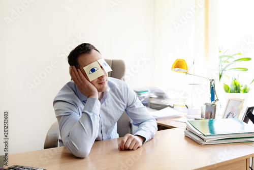 Valokuva Man, sticky notes and sleeping in office, exhausted and professional with bad mental health
