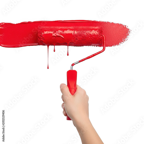 Hand holding red paint roller with fresh red paint