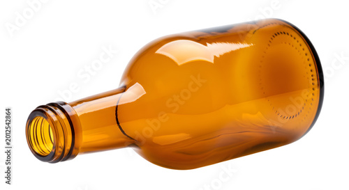 An empty amber glass bottle lying on its side isolated on transparent background
