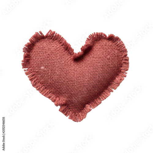 Heart shaped fabric patch made of red burlap textile with frayed edges isolated