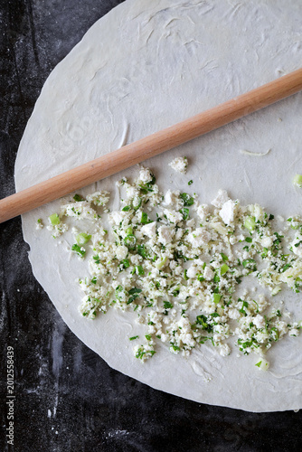 Homemade pastry dough with cheese and herb filling
