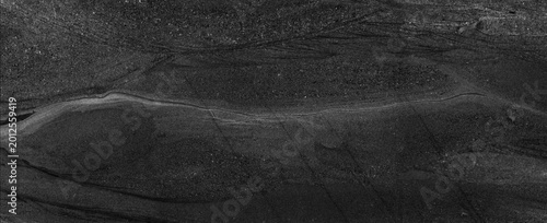 Black marble stone texture. Dark abstract background.