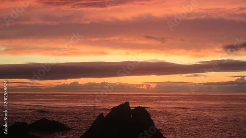 Sunset over the East China Sea with rocky coast in Amami Oshima, Japan