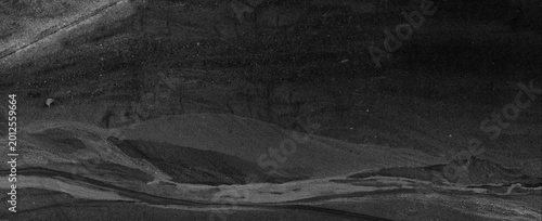 Black marble stone texture. Dark abstract background.