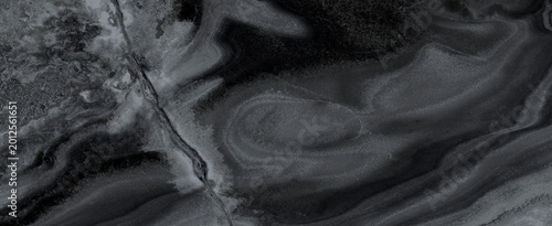 Black marble stone texture. Dark abstract background.