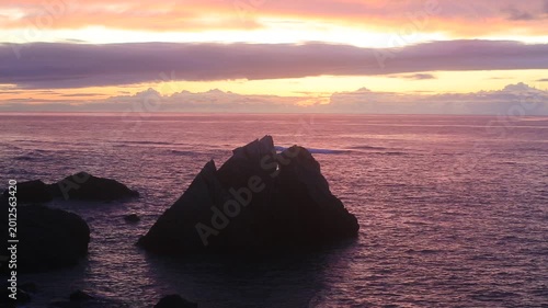 Sunset over the East China Sea with rocky coast in Amami Oshima, Japan