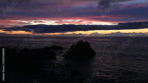 Sunset over the East China Sea with rocky coast in Amami Oshima, Japan