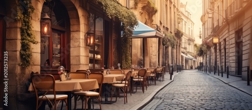 Experience the timeless charm and romantic tranquility of a sun-drenched European sidewalk cafe.