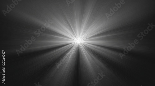 Bright central light emanating outward in rays against a dark background