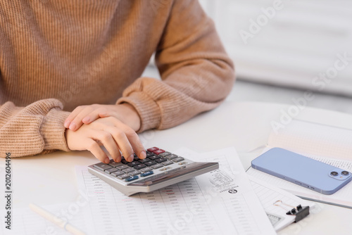 Mature woman in debt using ...