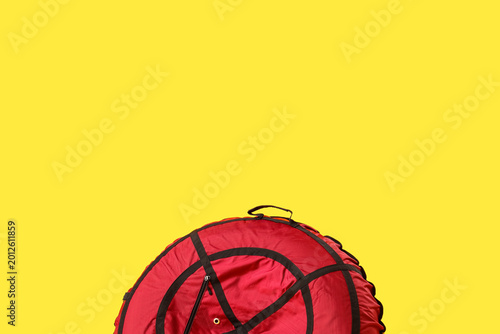 Snow tube on yellow background