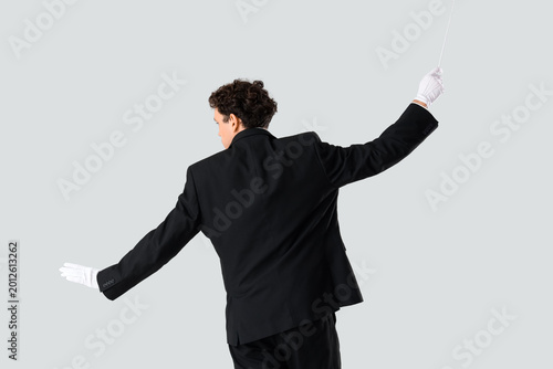 Young male conductor on gre...