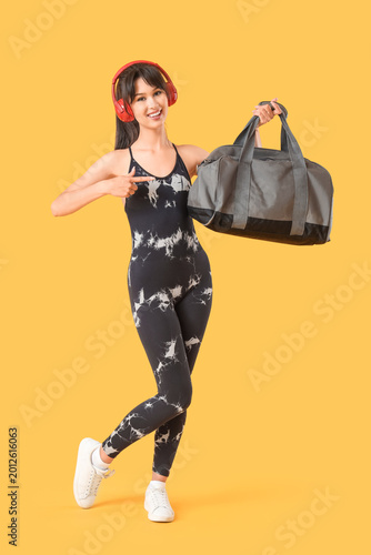 Young woman in headphones p...